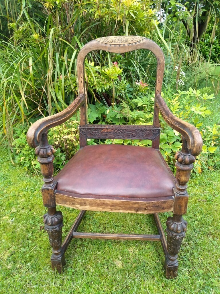Antique carver/fireside oak chairheavily carved in Strathaven, South
