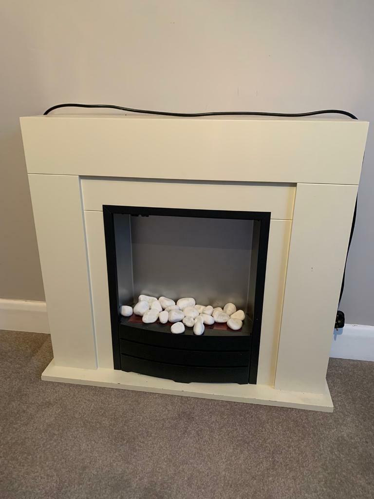 Cream fire surround and fire (electric) in York, North Yorkshire