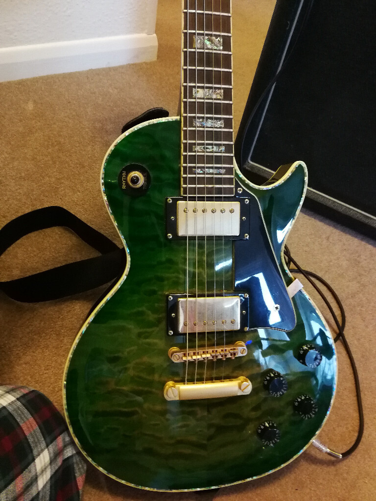 Les Paul style electric guitar byRaven West Guitars (RWG) flamed