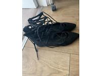 Black laced flat shoes