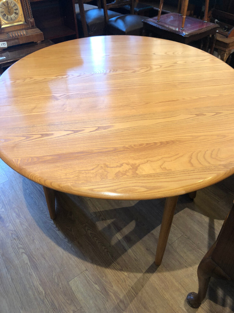 Ercol Windsor Gate Leg Table , in blonde wood . Can sit 4 people. Size