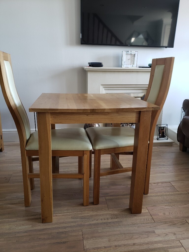 Oak furniture land two seater table and chairs in Coatbridge, North