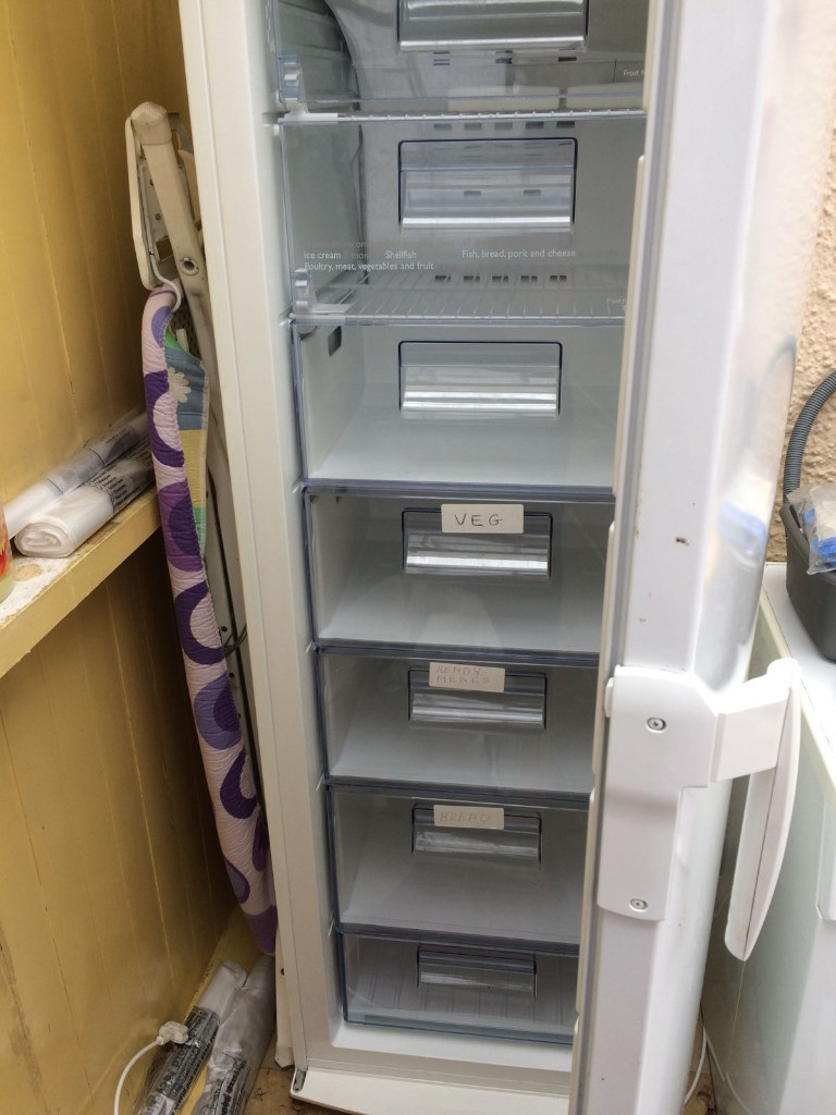 Upright Freezer, White with six draws and one compartment. Good