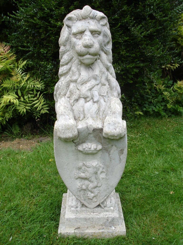 Concrete lion statue with shield and integrated plinth 32.5 inches high in Pinner, London