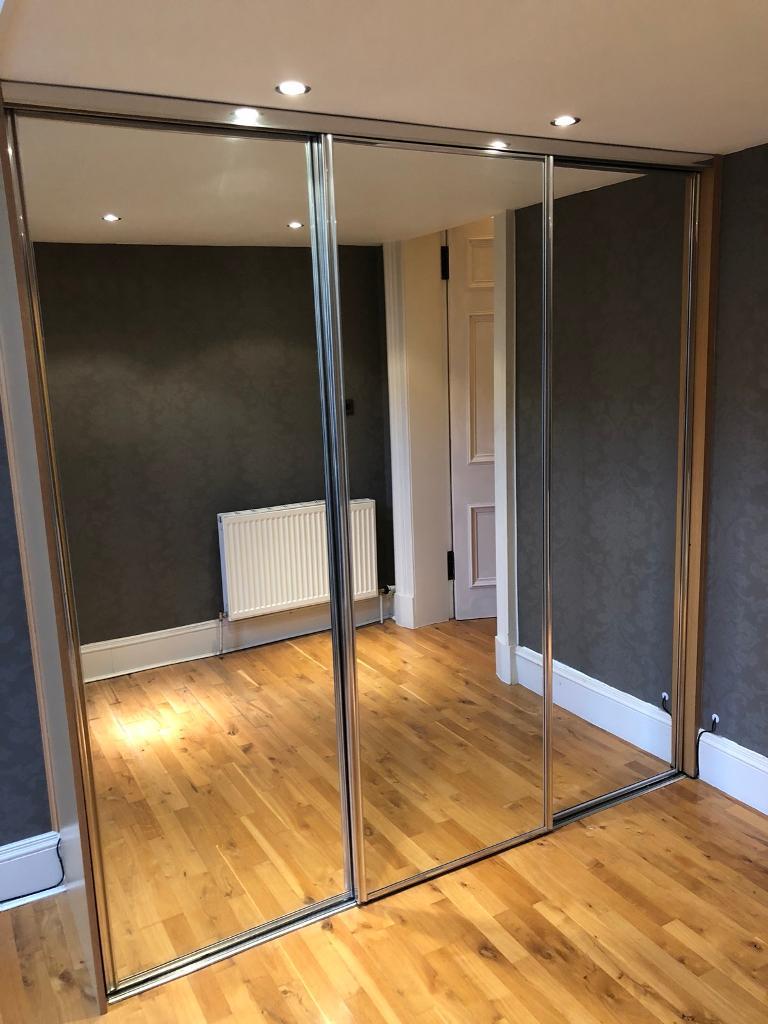 3 door mirrored sliding wardrobe with built in hanging rails, shelves