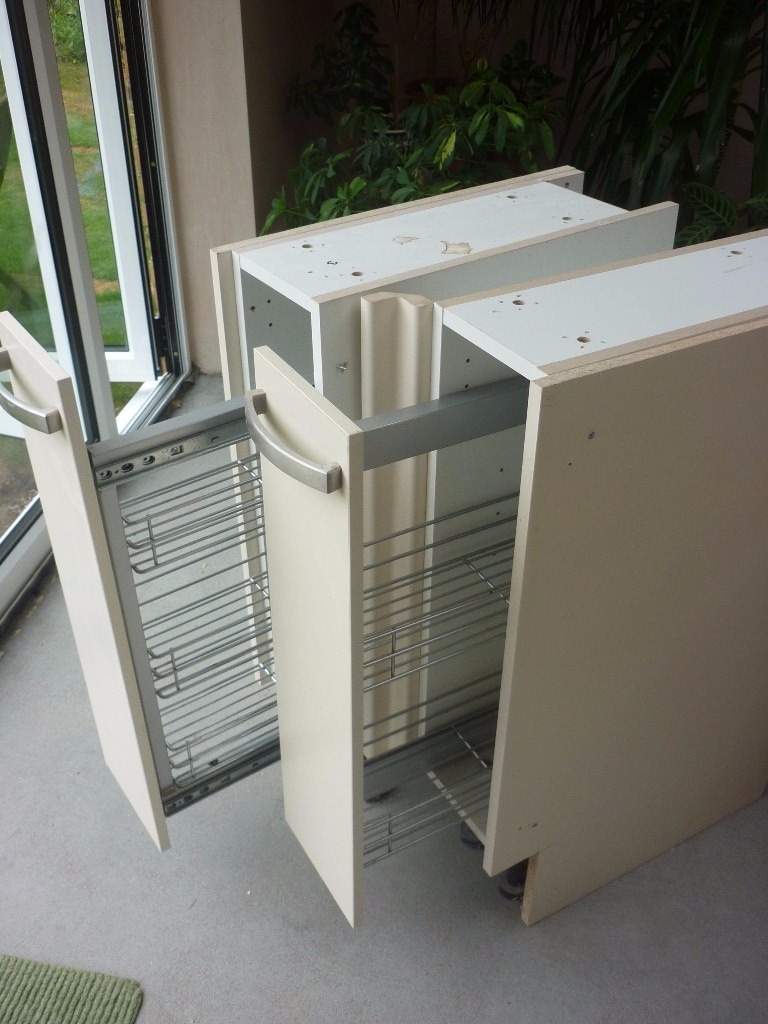 TWO HOWDENS KITCHEN BASE STORAGE UNITS WITH PULL OUT WIRE BASKETS ON