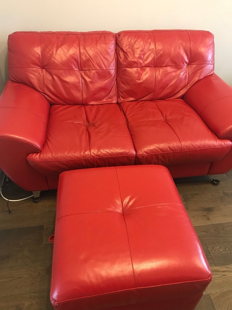 Red leather two seater sofa, with matching armchair & poof/footstool in Church Crookham