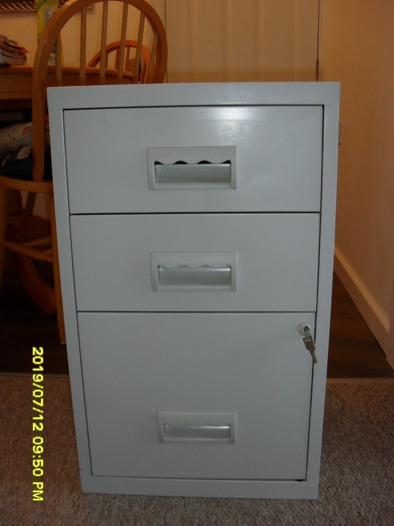 Small Metal Filing Cabinet With Two Small Draws And One Filing Draw