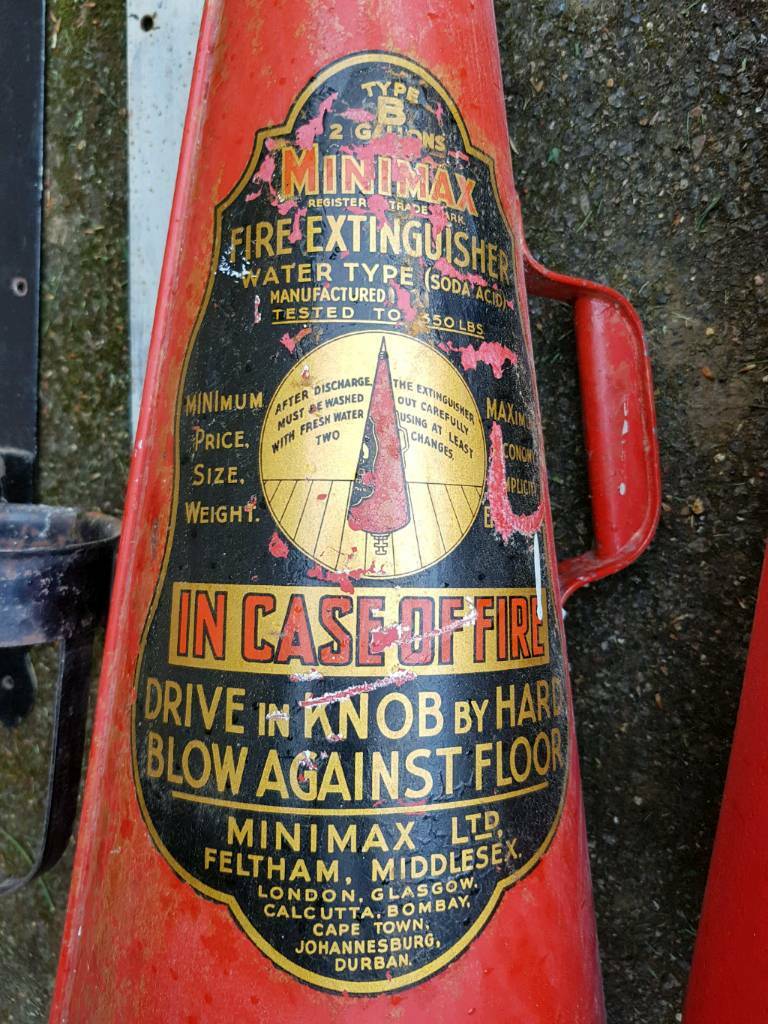 Vintage mini max fire extinguishers with wall brackets in Bury St