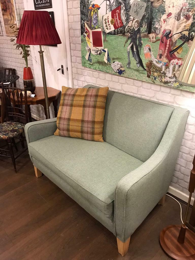 Small smart two seater settee in lovely green wool comfortable, spotless new upholstery, unused