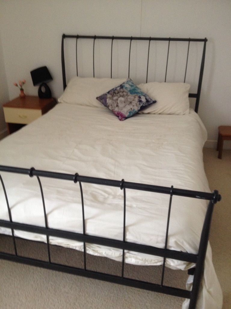 Black metal frame double bed with mattress in Cheltenham