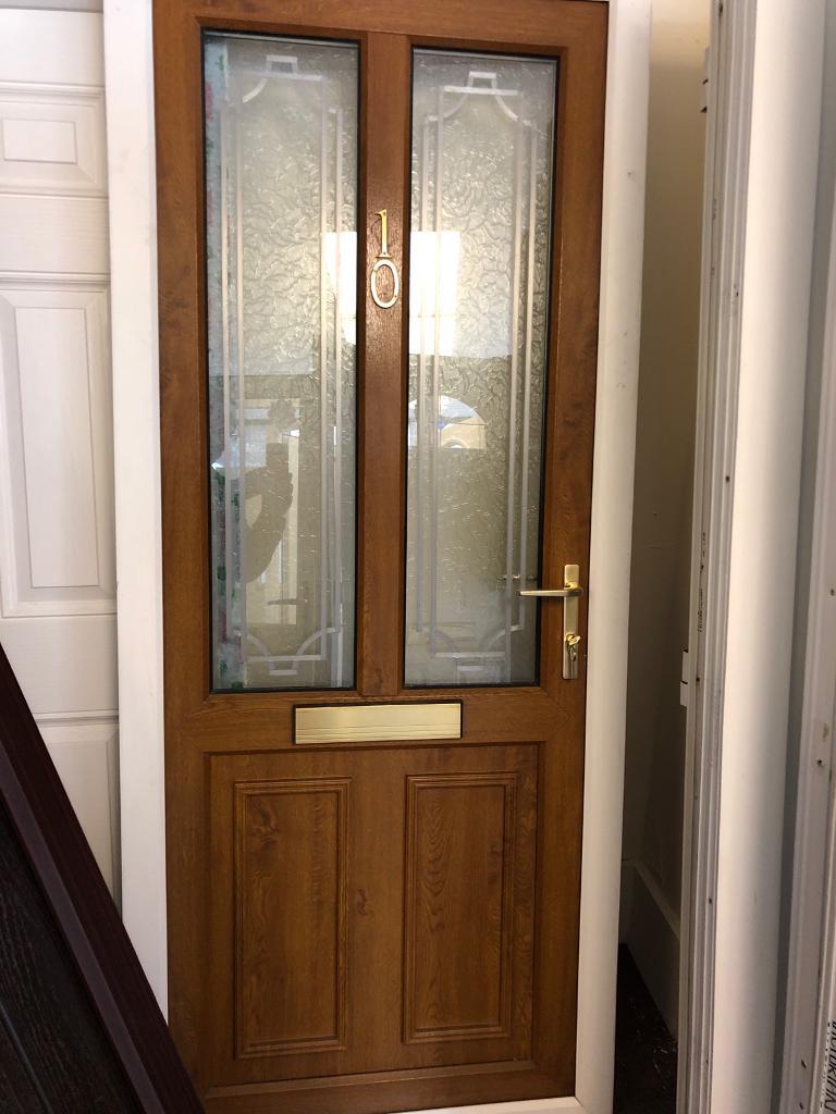 Upvc front door golden oak white outer frame in WestcliffonSea