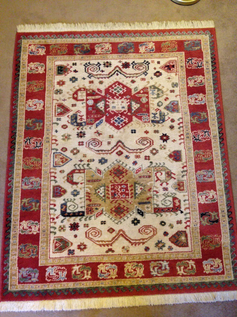 100 wool rug, warm rust/cream colours, perfect for fireside