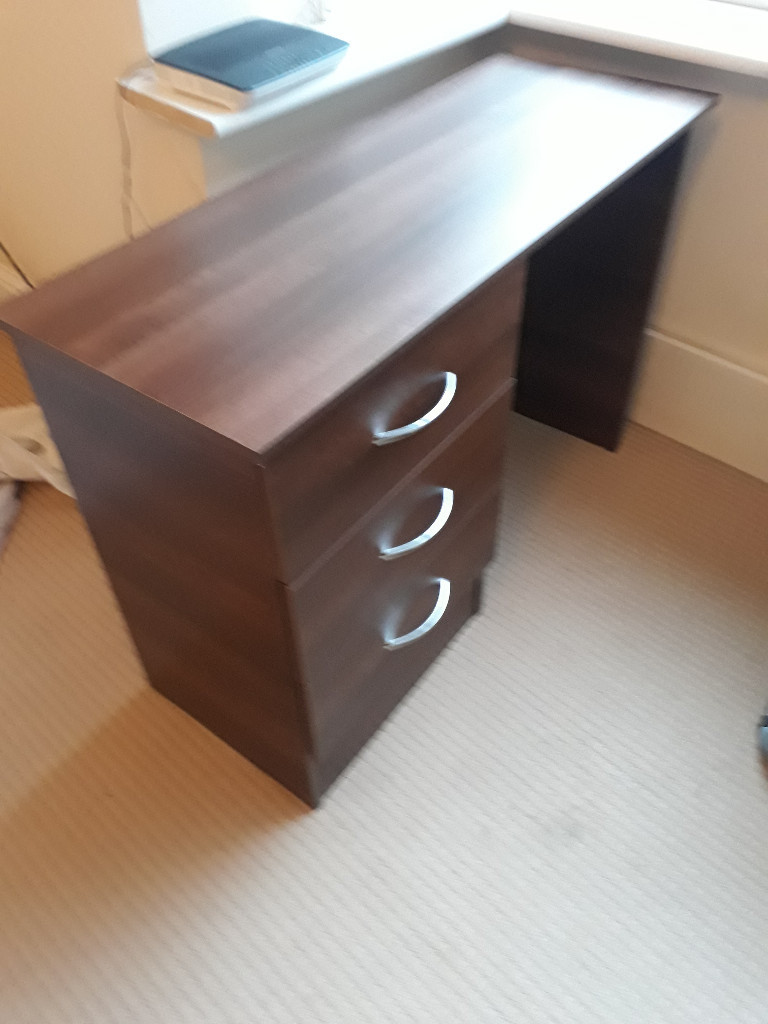 dark brown wood computer desk with 3 drawers at the side in