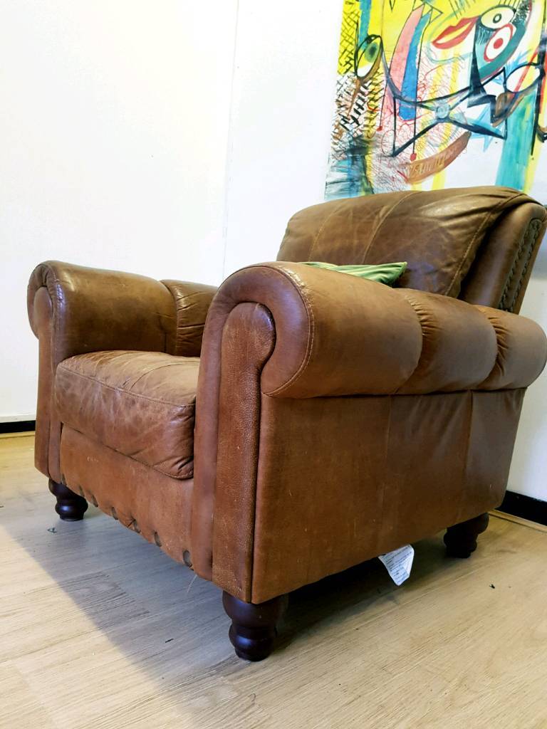 Chesterfield distressed tan leather fireside armchair in Kingswood