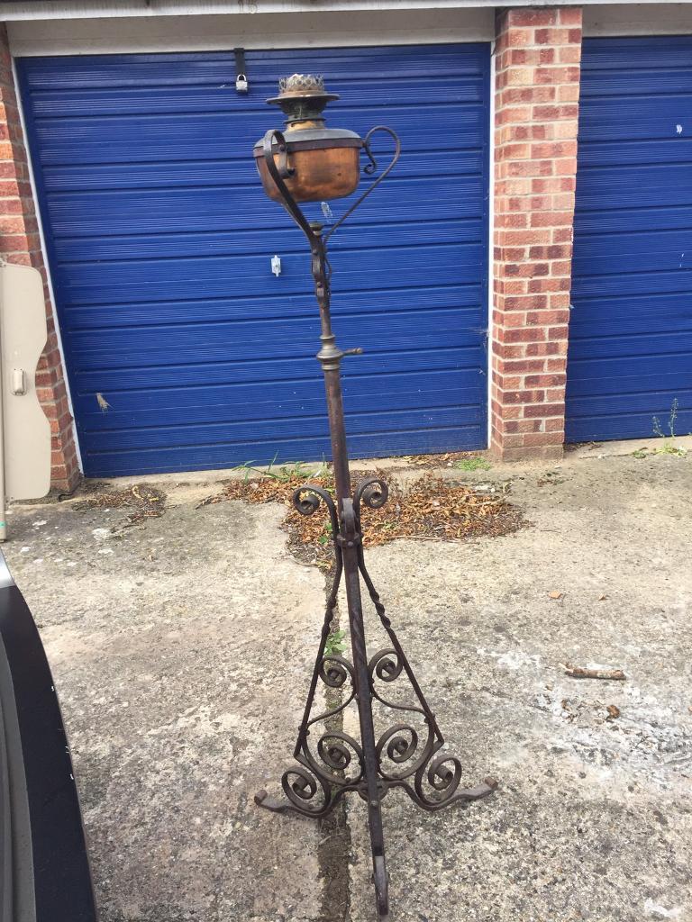 Victorian oil lamp with wrought iron stand, delivery available in