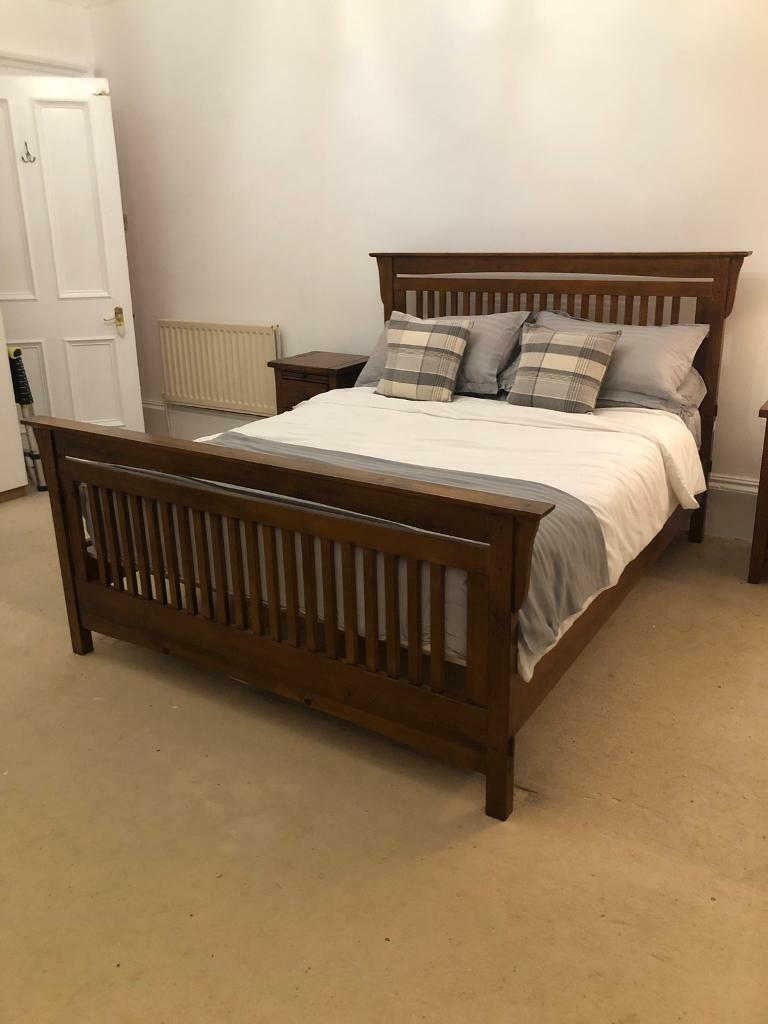 SOLD****** KING SIZED DARK SOLID WOOD BED FRAME AND