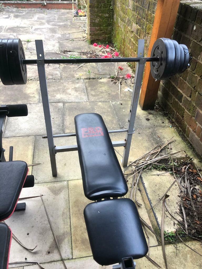 Gym workout bench with bar and weights in Southampton, Hampshire