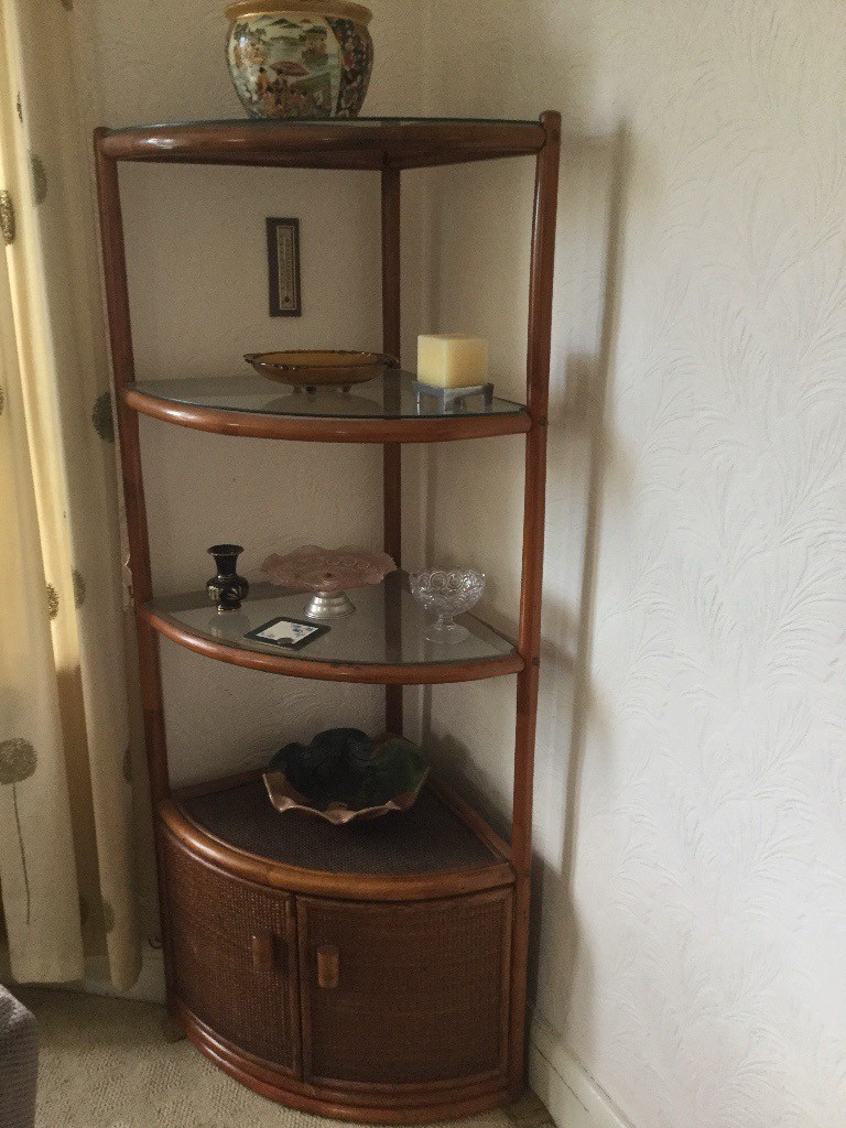 Cane corner unit with glass shelves and bottom doors in Whitchurch