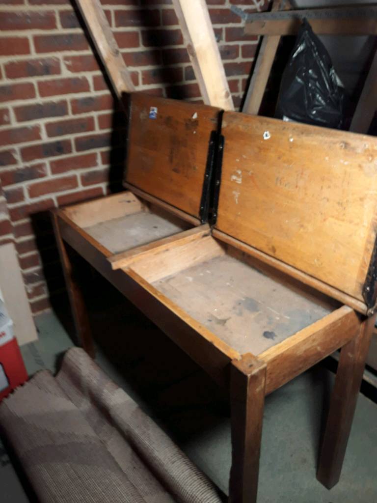 Old school desk. Twin desk with ink well holes in Martham, Norfolk