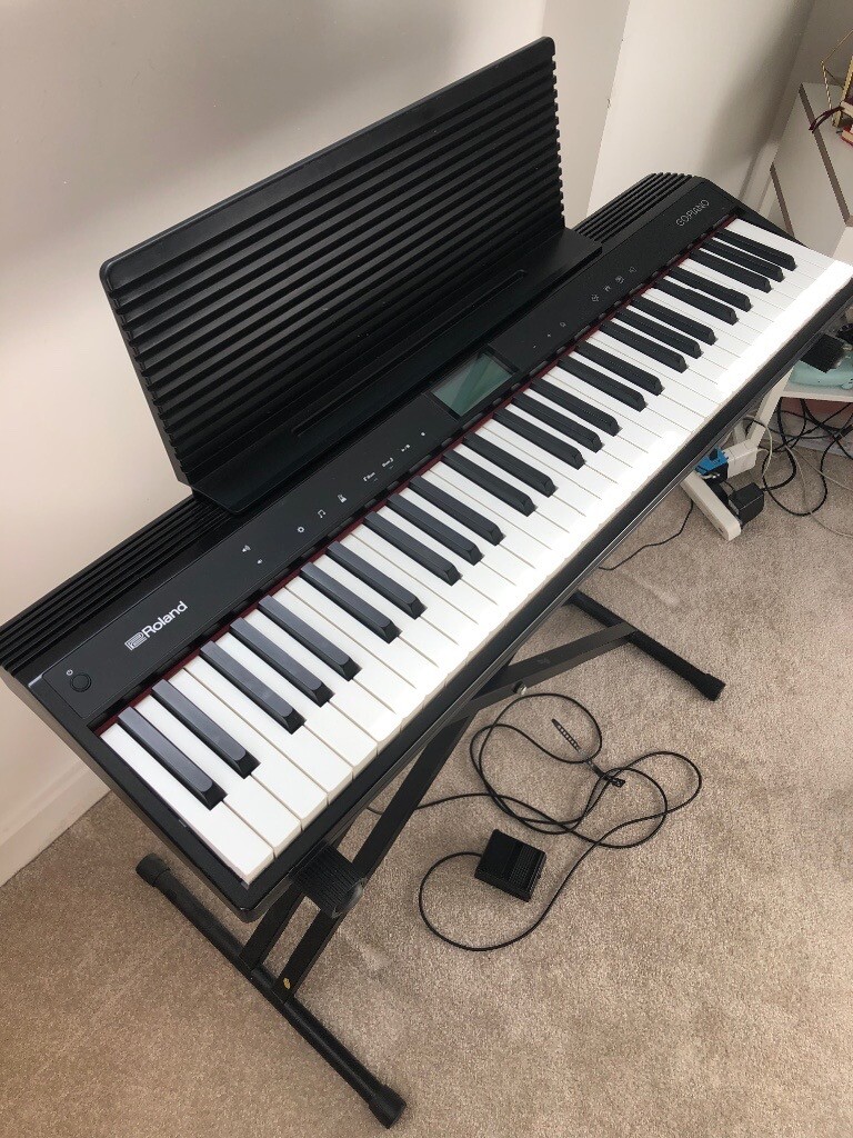 Roland electric keyboard with stand + pedal in Greenwich, London