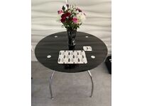 Black glass and silver metal dining table, no chairs