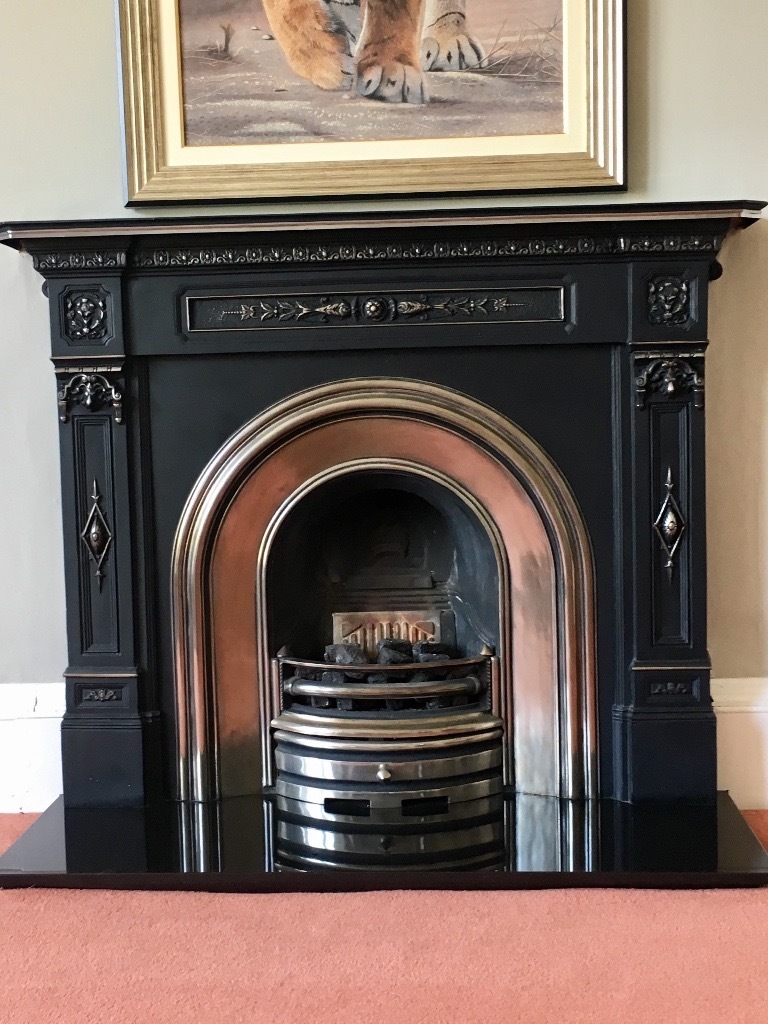 Victorian reproduction fireplace horseshoe design, black and