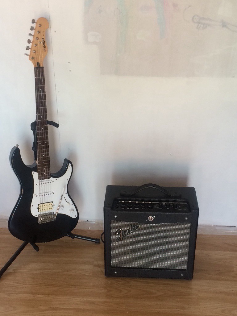 Yamaha electric guitar with fender amp and stand in Middleton