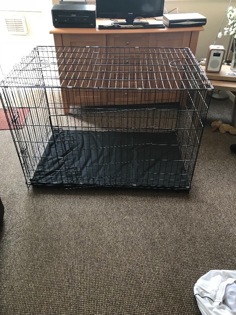 used large dog cage complete with bed used but in good condition in
