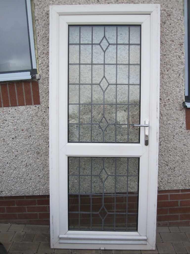 Used double glazed UPVC single door with internal leaded glass, lock