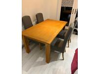 Oak extendable dining table with 4 fabric chairs 