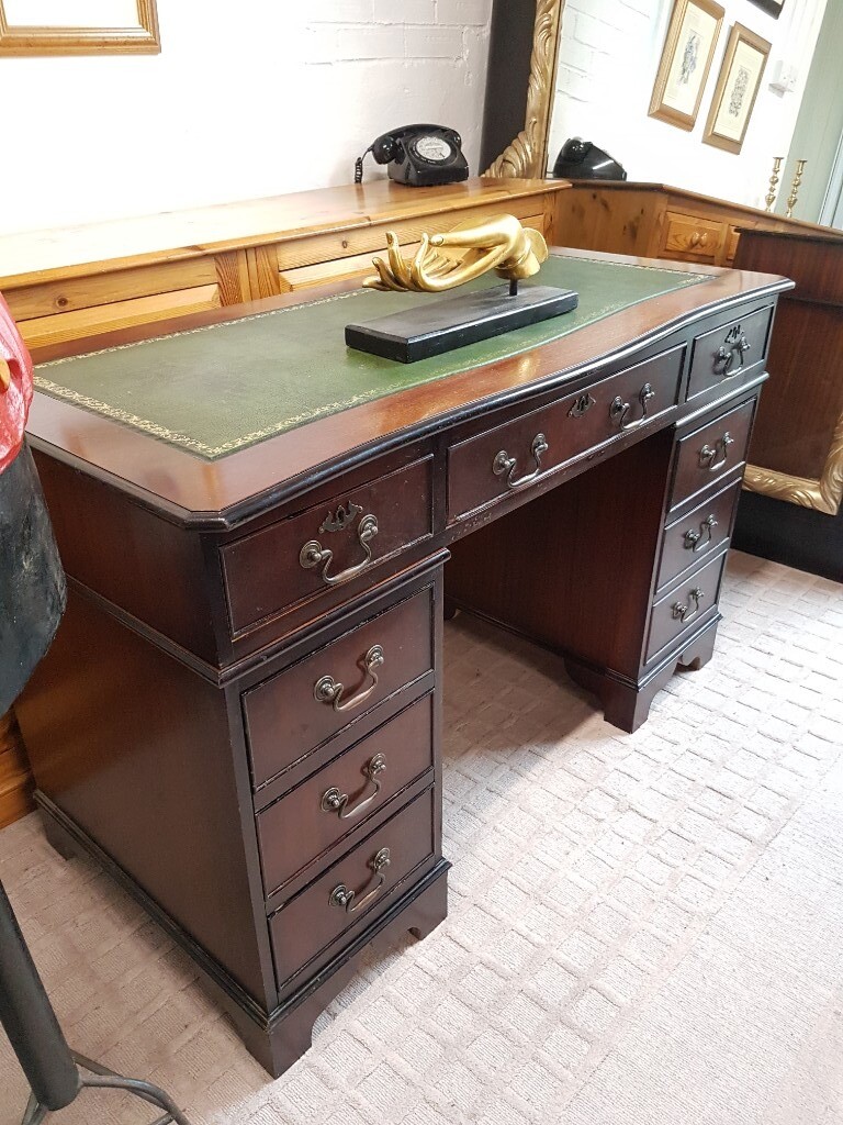Double pedestal captains desk with green leather inlay in North