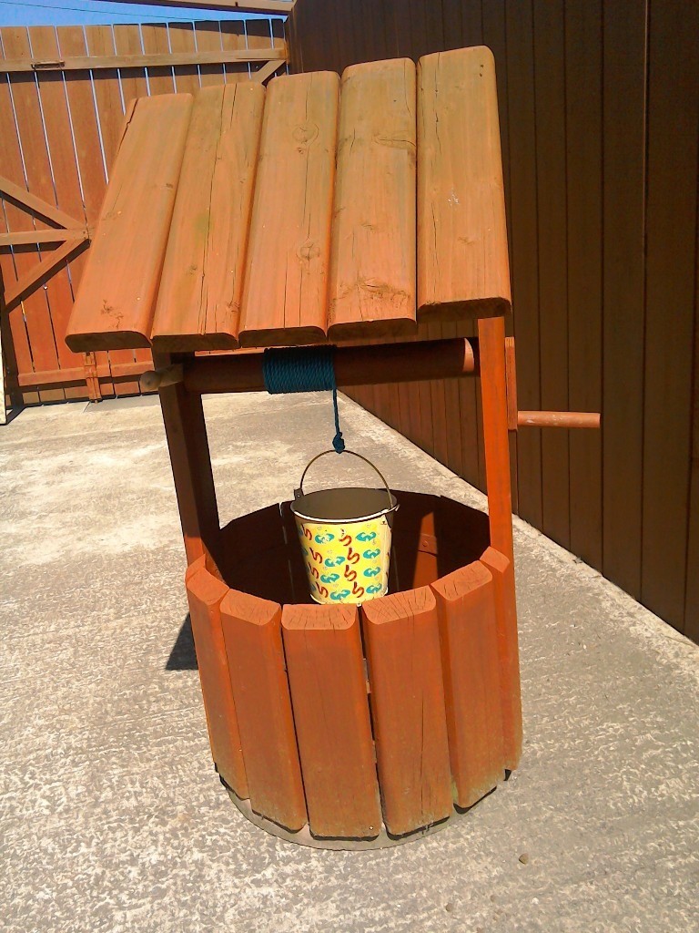 Wooden wishing well garden ornament in Newtownabbey, County Antrim