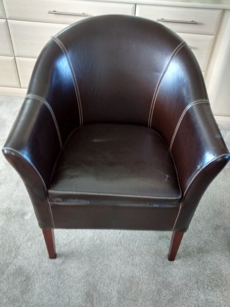 FREE TO GOOD HOME. Brown faux leather tub chair with white stitching