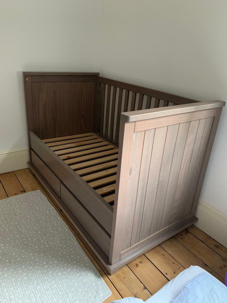 Baby Cot Chest Of Drawers Changing Table And A Book Shelf In