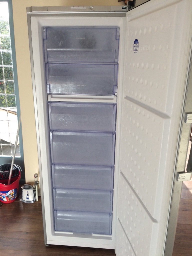 Large silver Beko freezer. 3 pull out drawers and 4 shelves with pull