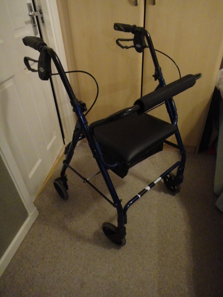 Lightweight 4 wheeled mobility walker with storage seat, folds