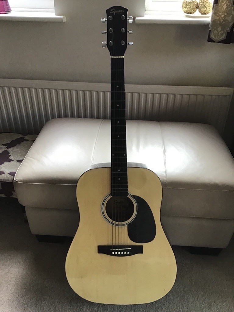 Fender Squier Acoustic Guitar with brand new set of spare Strings and