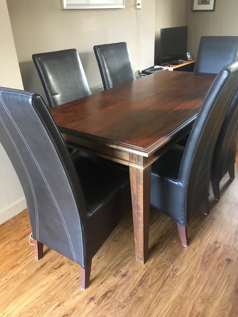 Barker and Stonehouse darkwood dining table and 6 high back leather