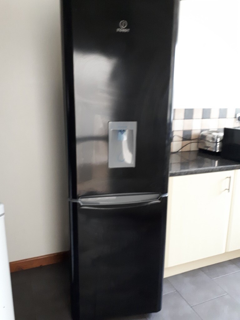 Indesit black fridge freezer, excellent condition. Has a water