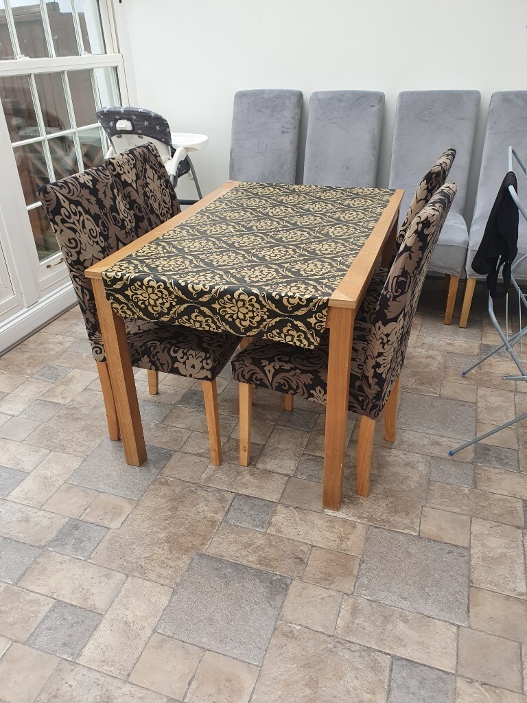 Solid Wood dining table with four chairs and chair covers ...