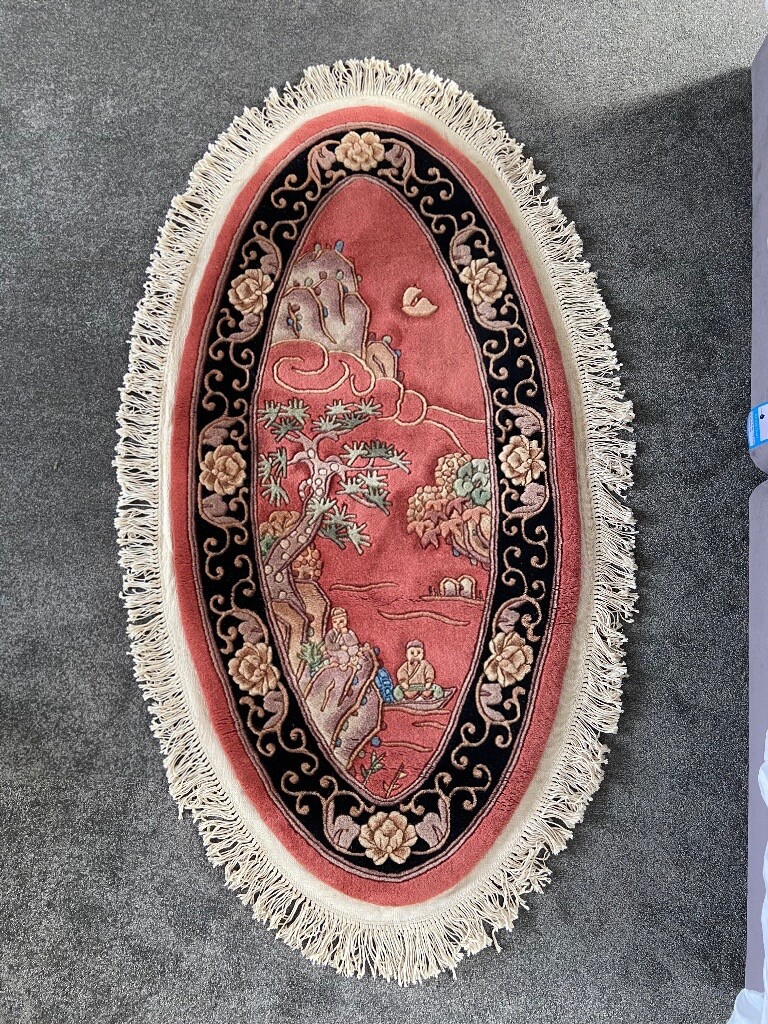 Oriental Style Oval Shaped Wool Rug with Tassles in Bromsgrove