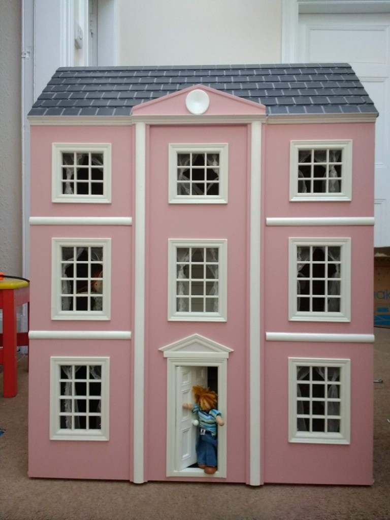ThreeStorey Dolls' House fully furnished with a family in residence
