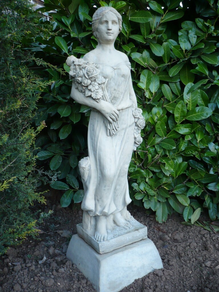 Garden statue of stone flower girl with stand in CarltoninLindrick