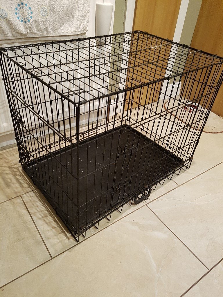Dog crate, medium size. Black, folding 2 door crate with plastic