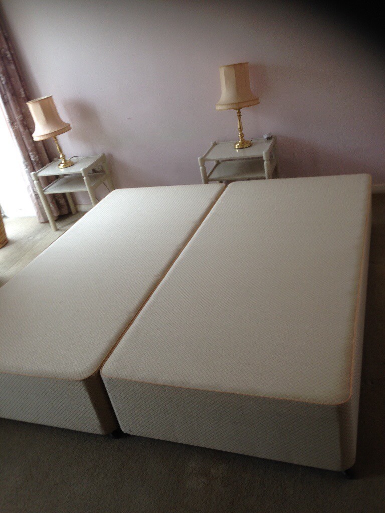 Pair of single divan bases on castors in Cirencester, Gloucestershire