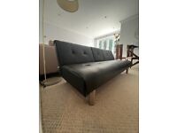 Black leather sofa / bed / futon