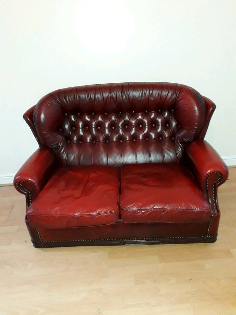 Dark red, real leather 2 seater sofa in Bradford, West Yorkshire
