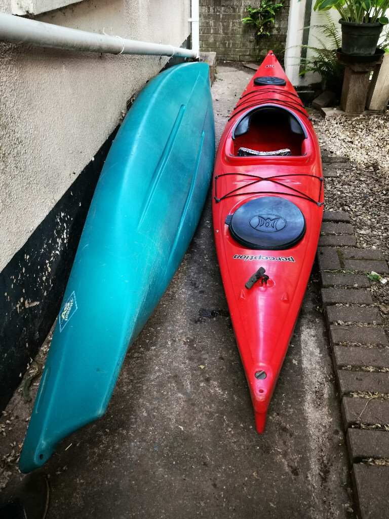 2 carolina 14.0 perception sea kayaks for sail. One red, one green