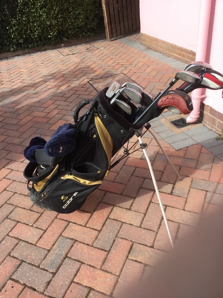 Set of Wilson Deep Red golf clubs, Ping G 5 driver, various rescue